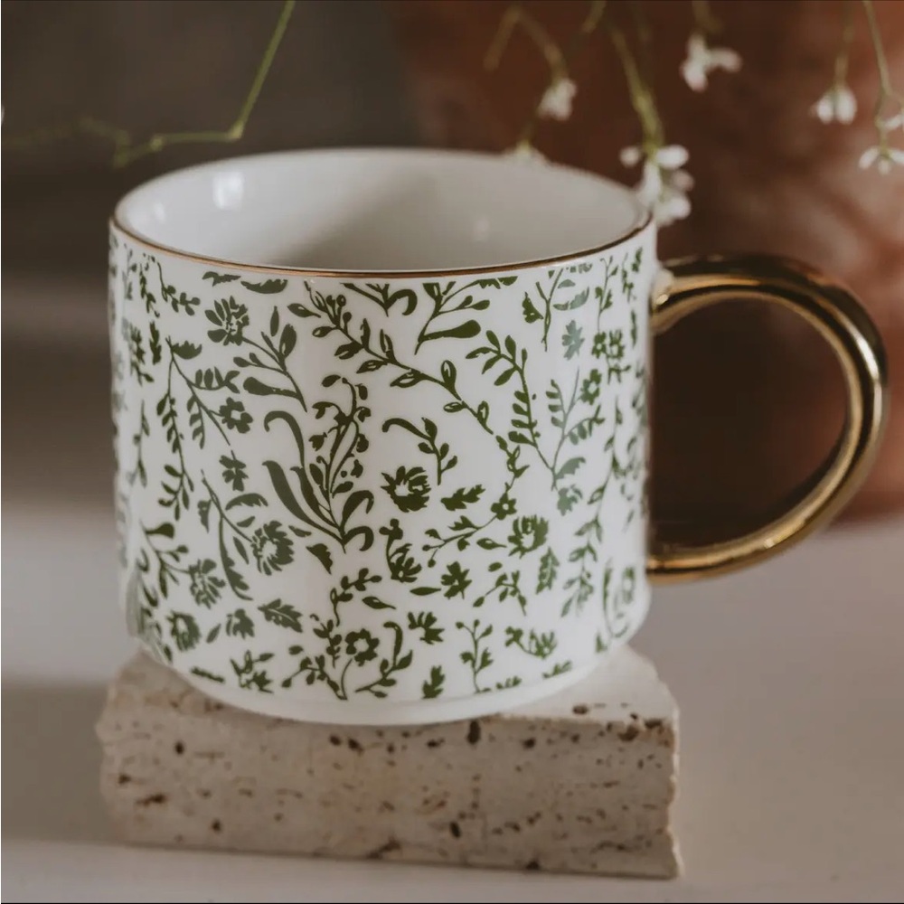 White Ceramic Mug with Green Floral Pattern and Gold Handle